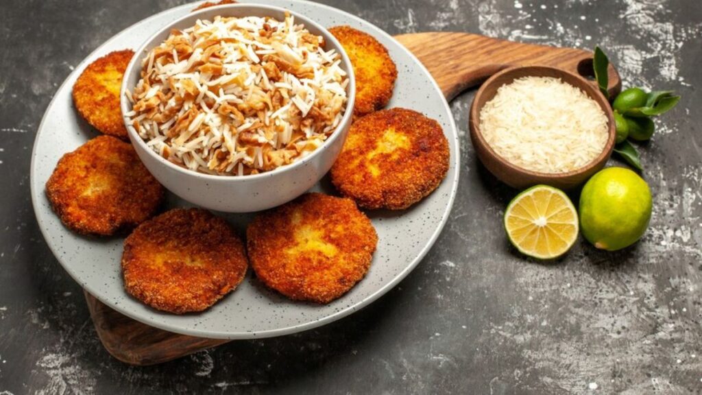 Low-calorie aloo tikki served on a plate with a bowl of chutney,