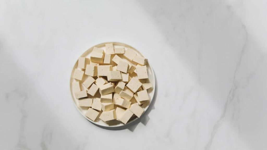 Photo of Tofu on White Plate Against White Background