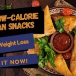 Thumbnail highlighting '21 Low-Calorie Indian Snacks for Weight Loss' with a plate of samosas, chutney, tomatoes, and fresh parsley on a wooden table.