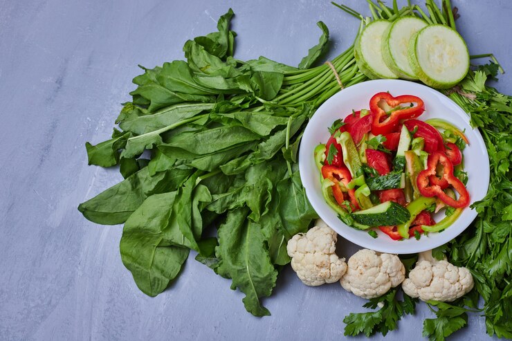 Vegetable salad with herbs on blue